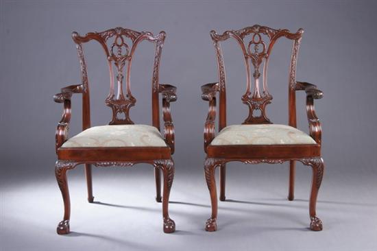 Appraisal: PAIR CHIPPENDALE STYLE CARVED MAHOGANY ARMCHAIRS th century Each carved