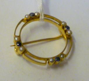 Appraisal: AN EDWARDIAN CT GOLD BROOCH of open circular form set