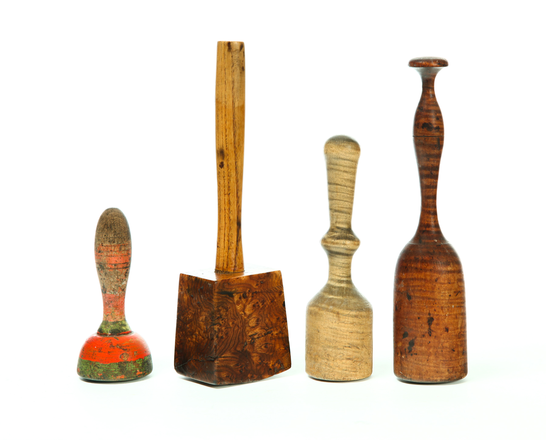 Appraisal: FOUR WOODEN MALLETS AND PESTLES American nd half- th century