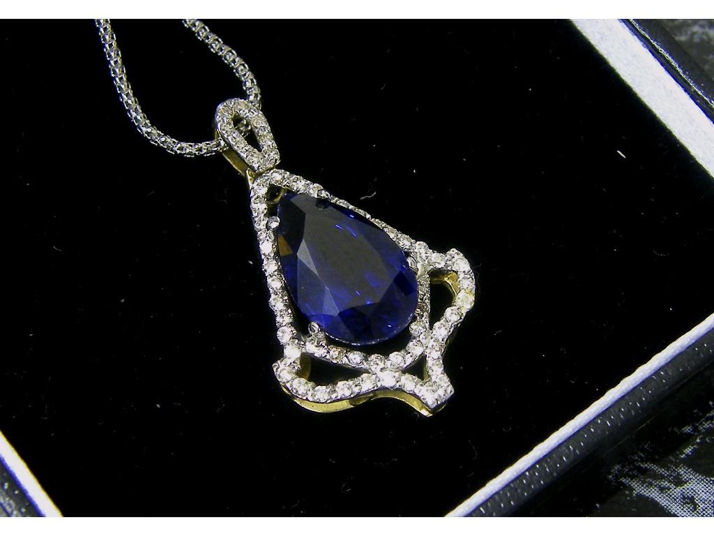 Appraisal: Attractive pear shape sapphire and diamond pierced pendant in a