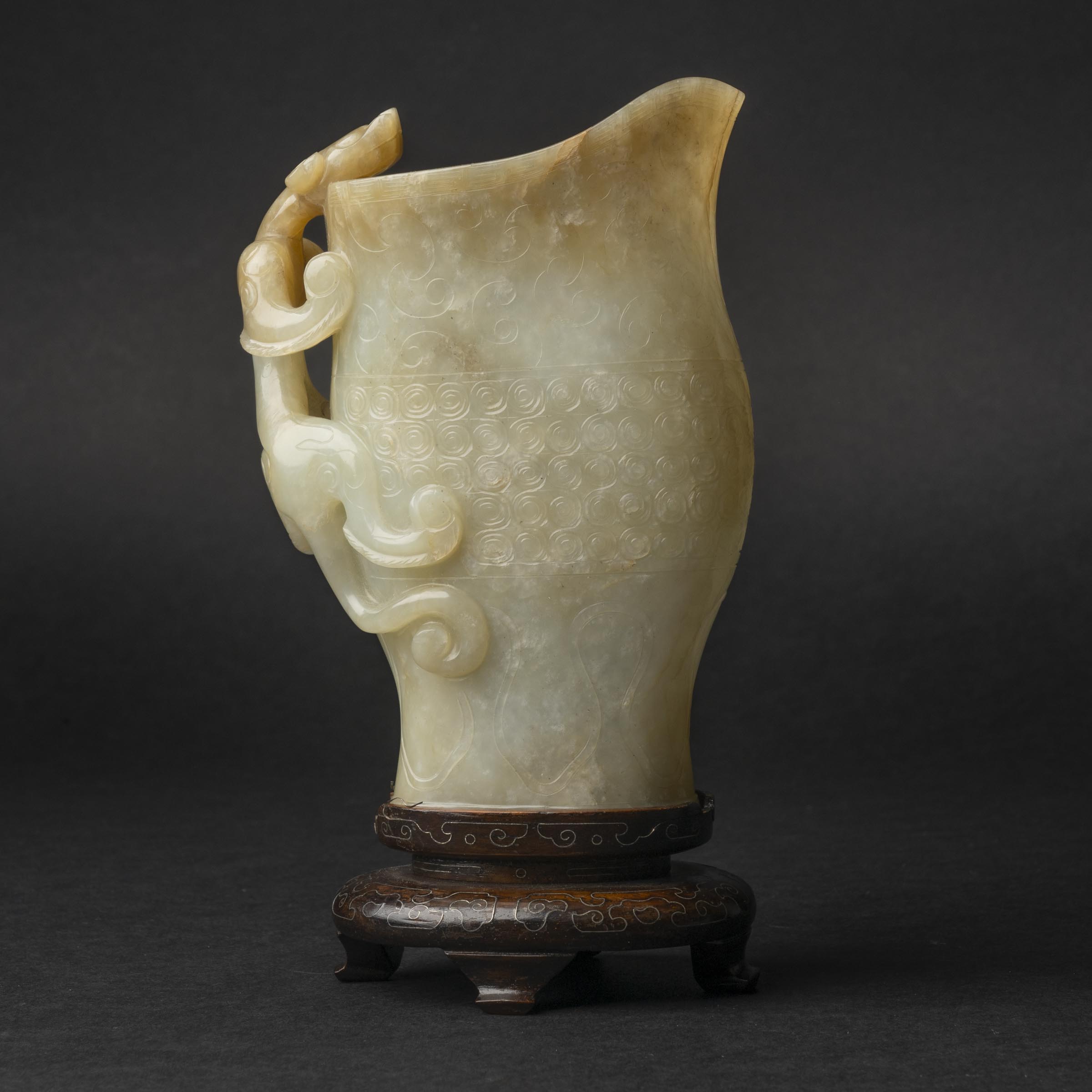 Appraisal: A Finely Carved White and Brownish-Yellow Russet Jade Rhyton Gong