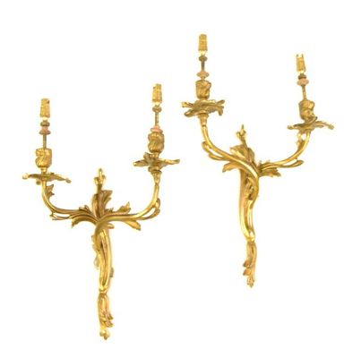 Appraisal: A pair of gilt brass two branch wall lights of