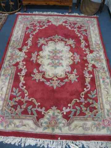 Appraisal: Chinese Sculptured Wool Rug floral with red field ivory trim