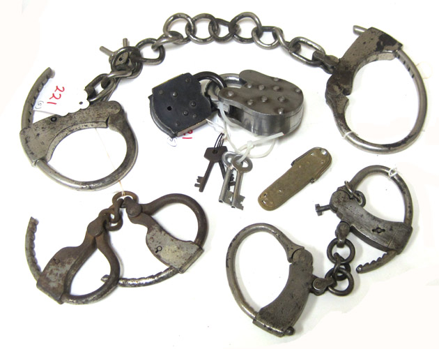 Appraisal: THREE PAIRS OF ANTIQUE POLICE RESTRAINTS PLUS TWO PAD LOCKS