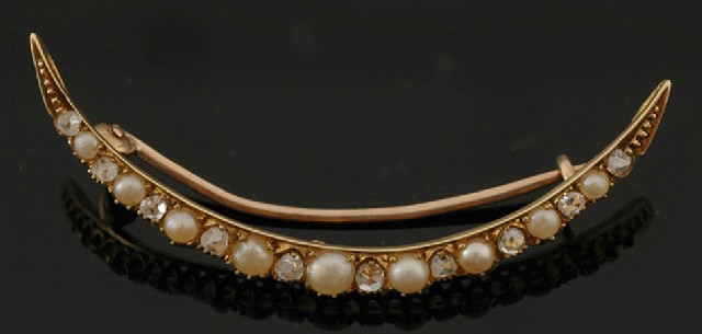 Appraisal: An Antique seed pearl and diamond brooch The crescent shaped