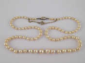 Appraisal: A natural pearl necklace with an old cut marquise shape