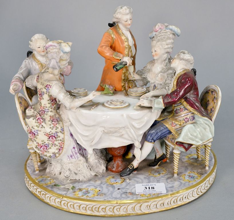 Appraisal: Porcelain group with five people at a table marked with