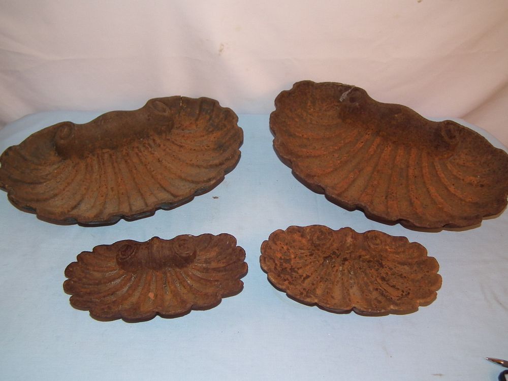 Appraisal: ANTIQUE IRON GARDEN SHELLS Lot of old iron garden ornaments