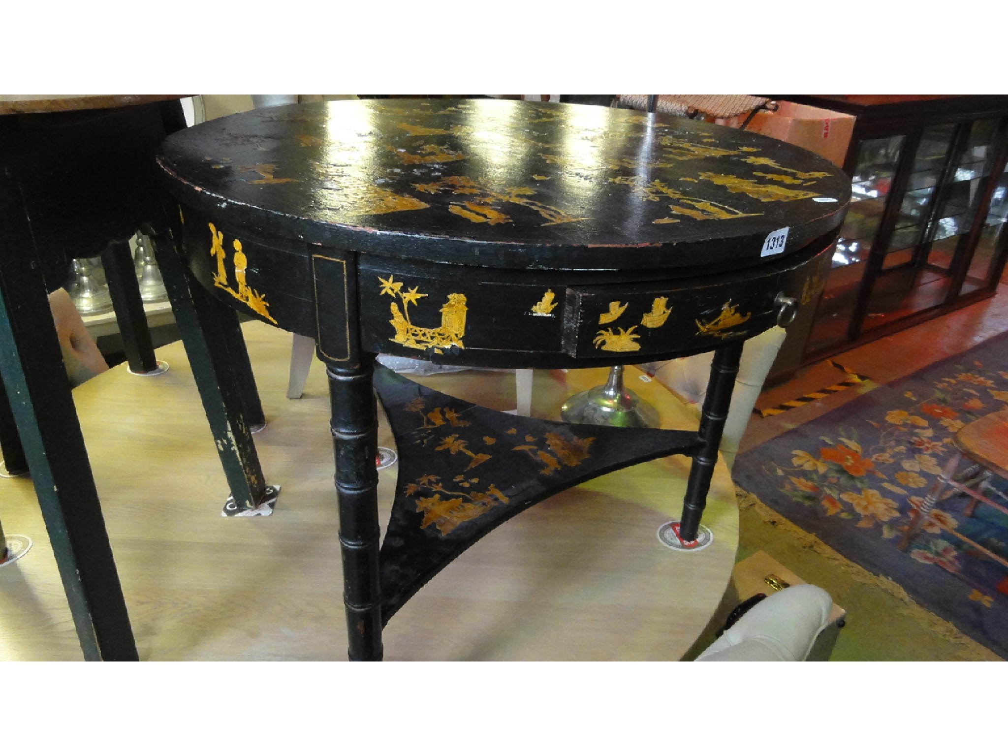 Appraisal: A Regency style ebonised occasional table of circular form with