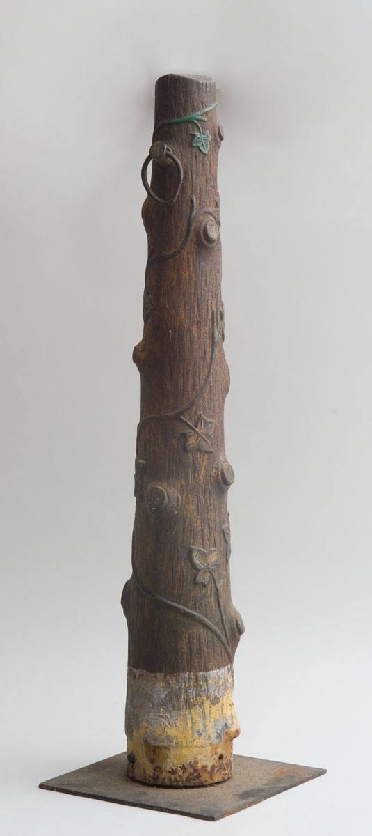 Appraisal: CAST-IRON TREE TRUNK-FORM HITCHING POST On stand x x in