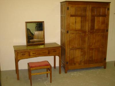 Appraisal: AN ADZED OAK PART BEDROOM SUITE comprising multi panelled double