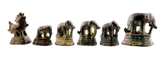 Appraisal: Bronze figural opium weights graduated standing elephants and mythical creature