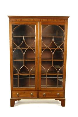 Appraisal: A Victorian mahogany bookcase with a pair of astragal glazed