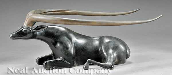 Appraisal: A Continental Patinated Sculpture of a Recumbent Antelope stylized figure