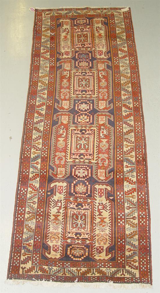 Appraisal: Tribal Persian Oriental Runner Wool on cotton Russet navy and