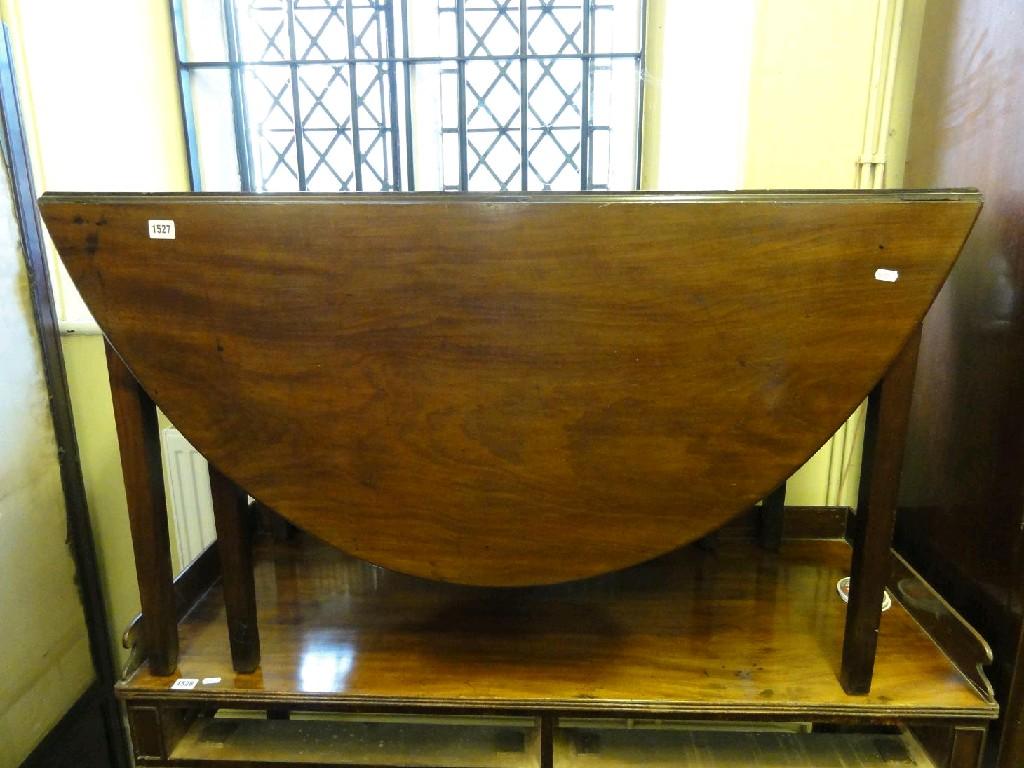 Appraisal: A th century mahogany oval drop leaf gate leg dining