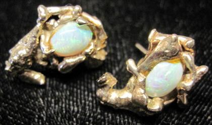 Appraisal: karat yellow gold opal earrings Oval opal studs featuring abstract