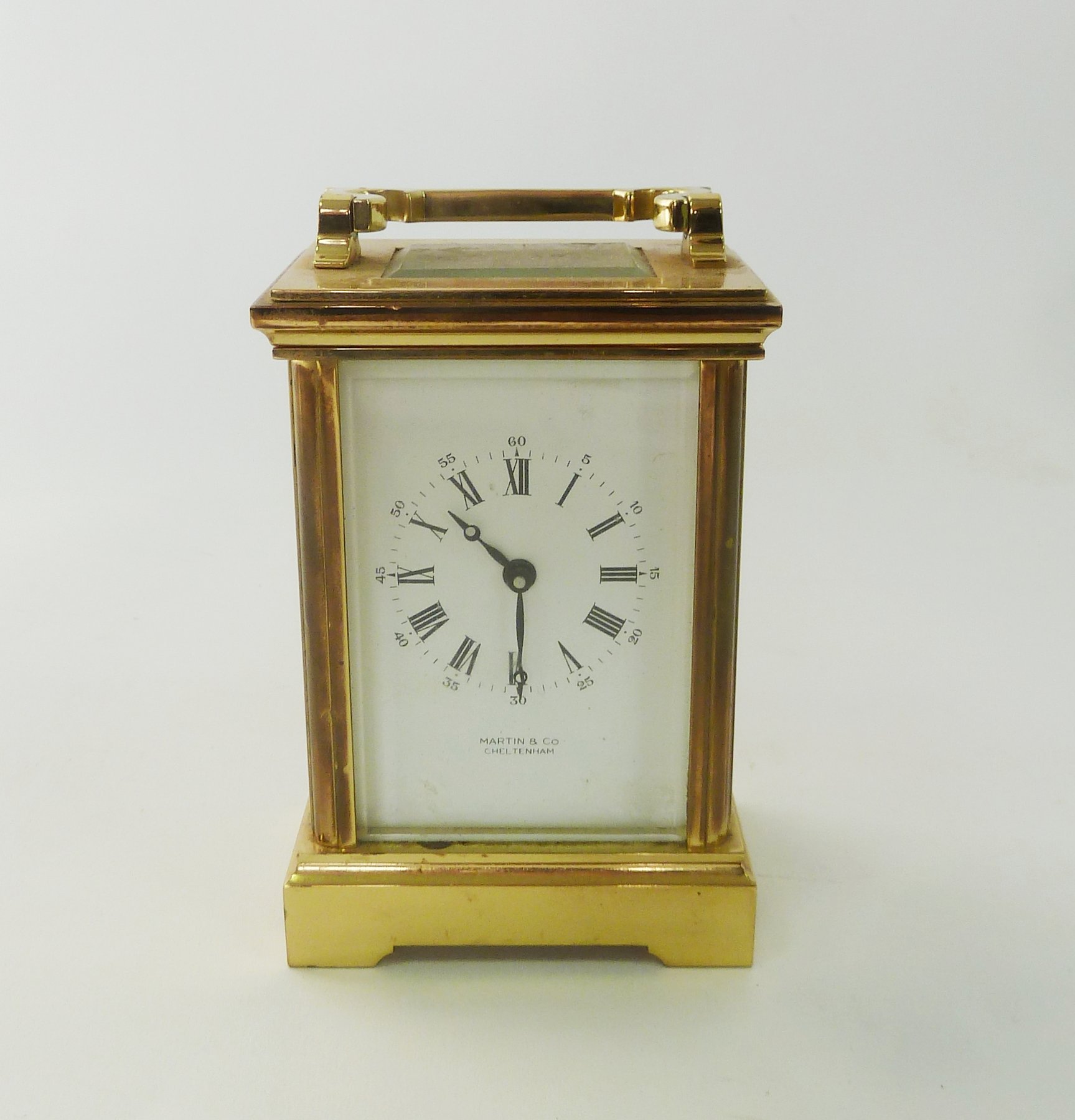 Appraisal: A gilt brass cased carriage clock the white enamel dial