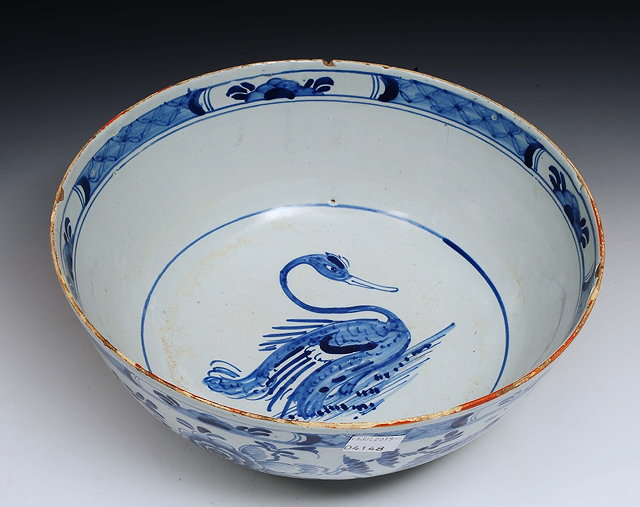 Appraisal: An English Delft ware bowlcirca painted with a swan to