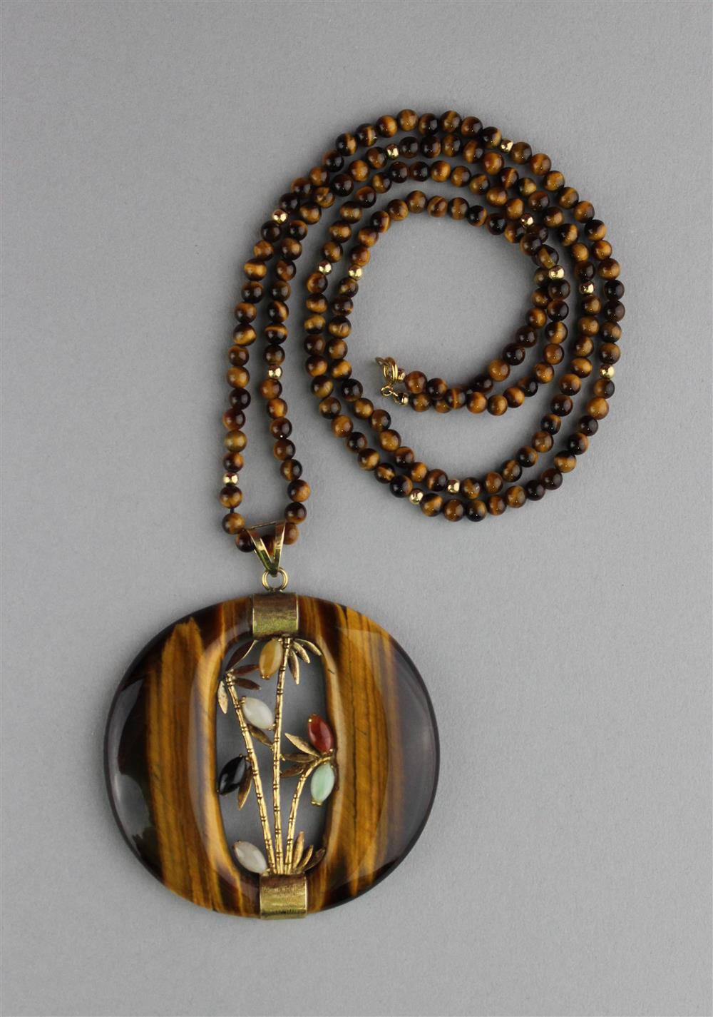 Appraisal: TIGER EYE AND K YELLOW GOLD PENDANT ON TIGER EYE