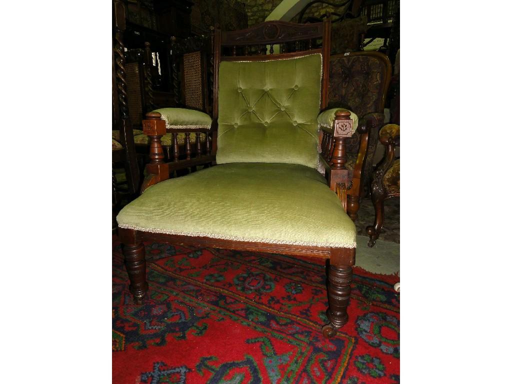 Appraisal: A late Victorian Edwardian armchair with upholstered seat and button