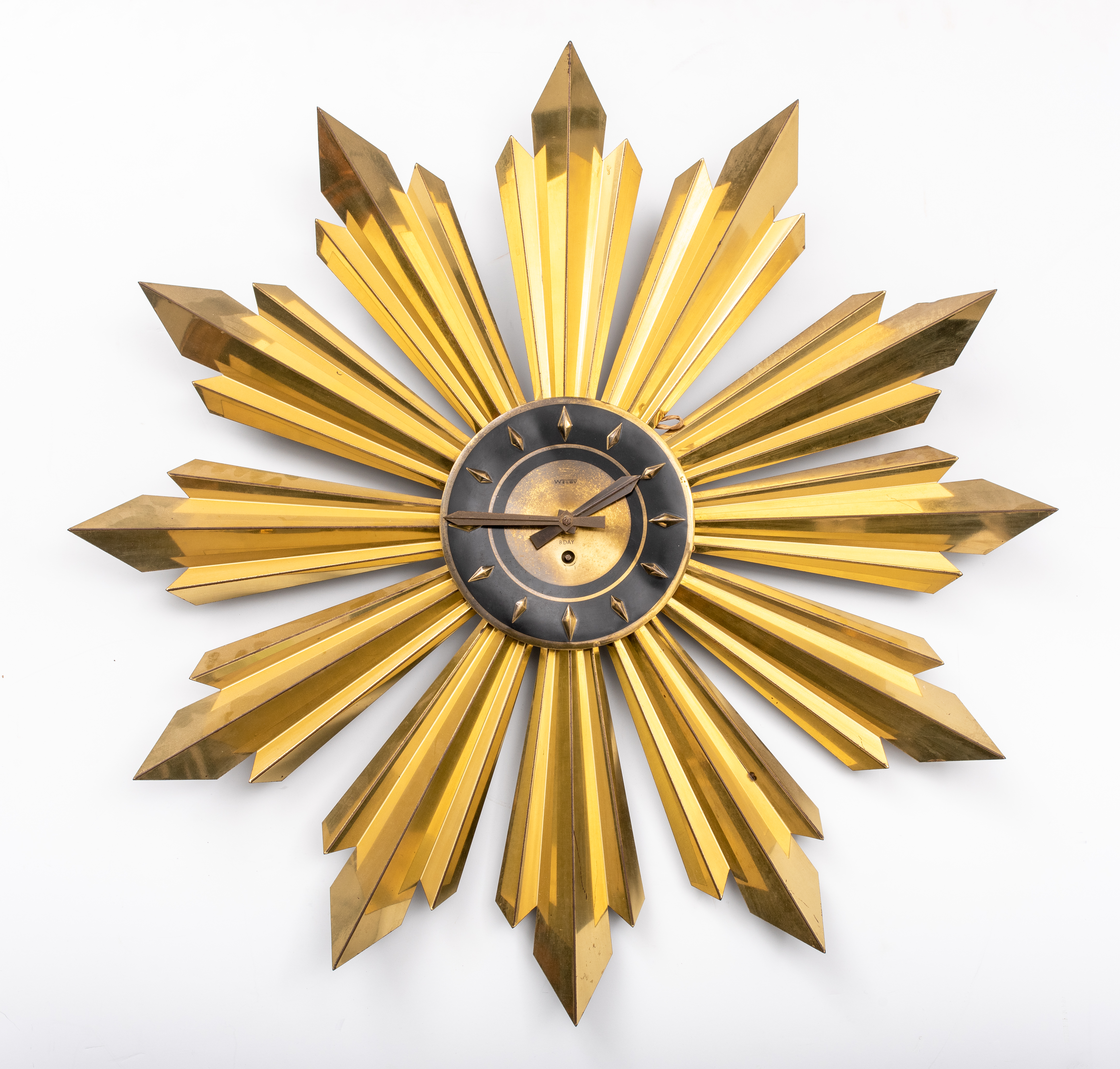 Appraisal: MIDCENTURY MODERN SUNBURST WALL CLOCK S Midcentury modern sunburst wall