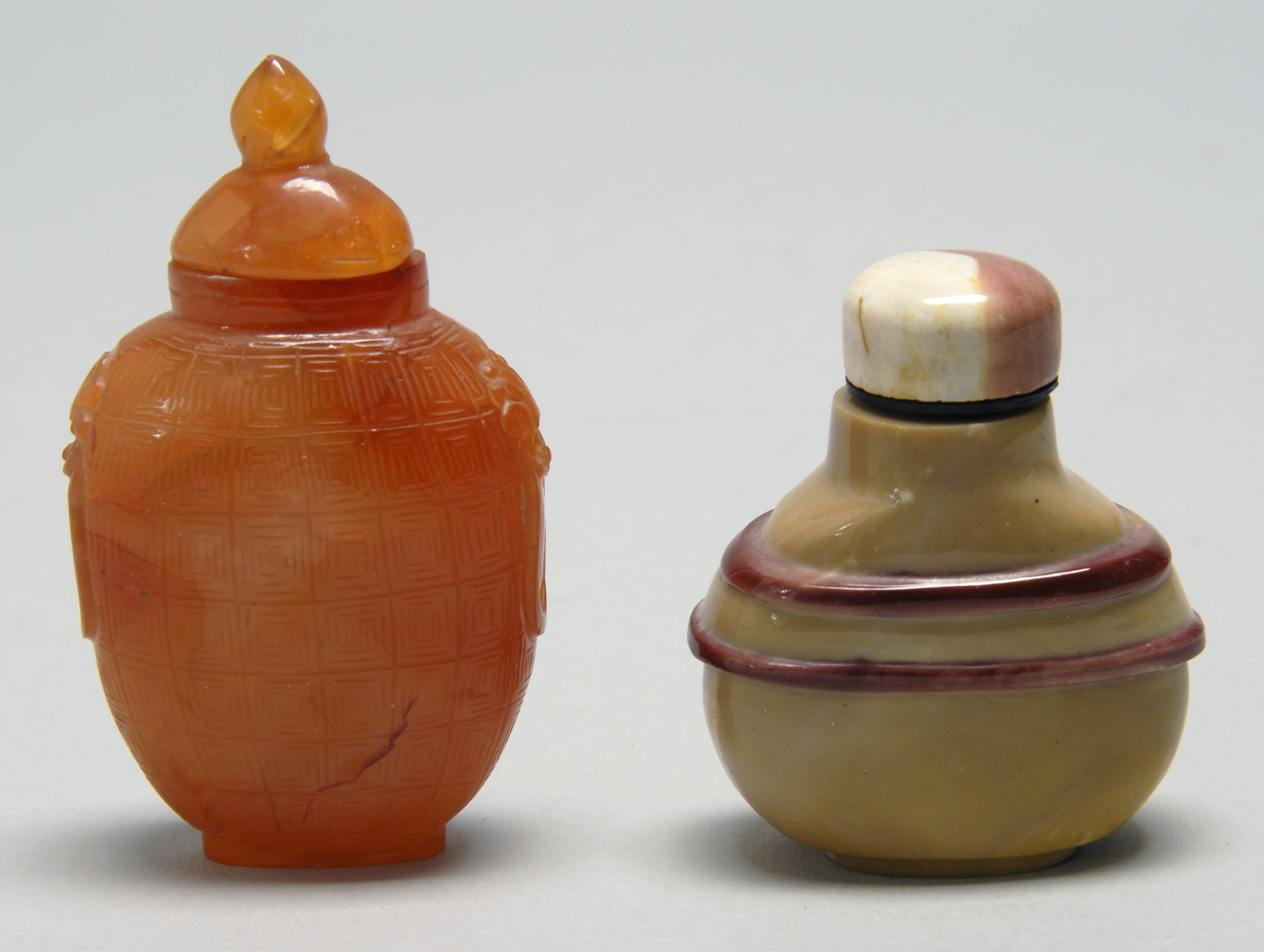 Appraisal: TWO SNUFF BOTTLES Carnelian in spade shape with basket-weave design