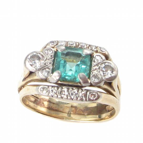 Appraisal: An emerald diamond and platinum-topped gold ring