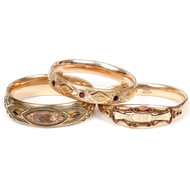 Appraisal: Three Victorian gold filled hinged bangle bracelets with chased layered