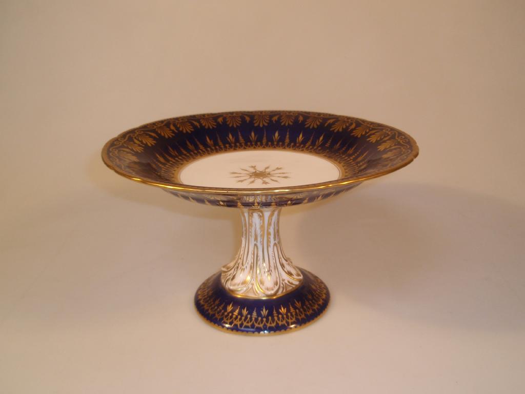 Appraisal: A thC porcelain pedestal cake stand the deep blue borders