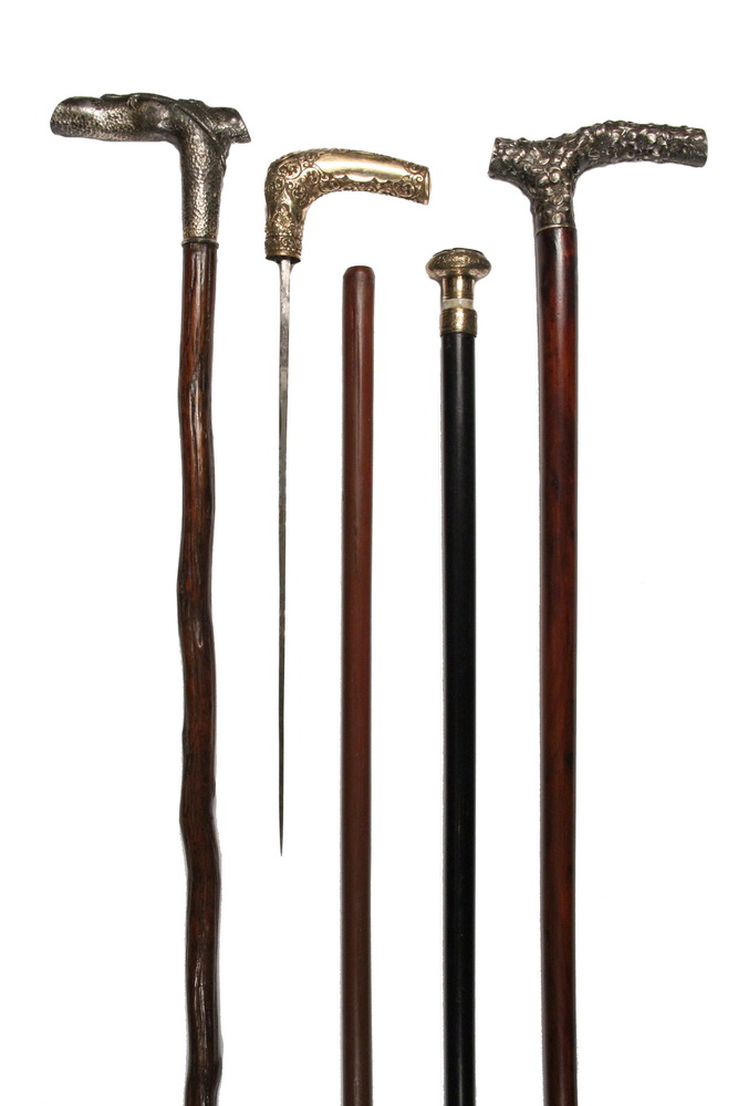 Appraisal: SILVER OR GOLD HANDLED CANES ONE CONCEALING A SWORD -