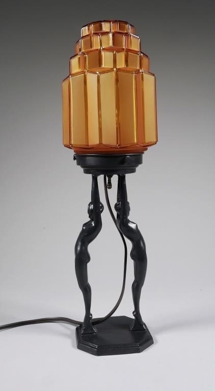 Appraisal: Art deco figural nude table lamp with amber skyscraper glass