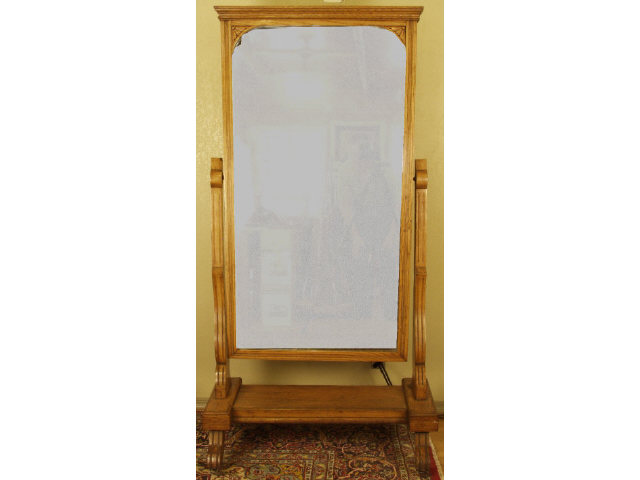 Appraisal: Heavy American oak cheval mirror on castors with finished paneled