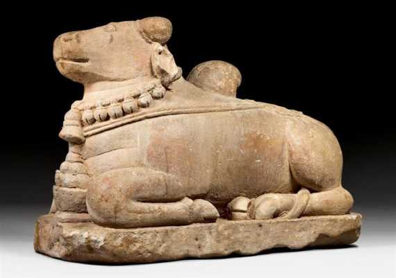 Appraisal: A SANDSTONE FIGURE OF NANDI THE CARRIER OF SHIVA India