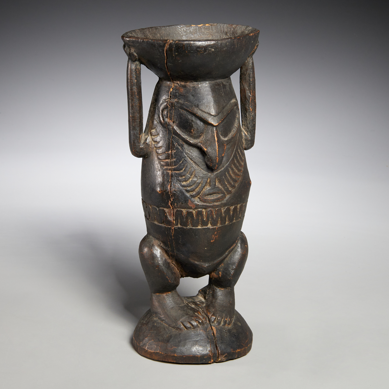 Appraisal: EAST SEPIK FINELY CARVED FIGURAL BETEL MORTAR Ramu River Papua