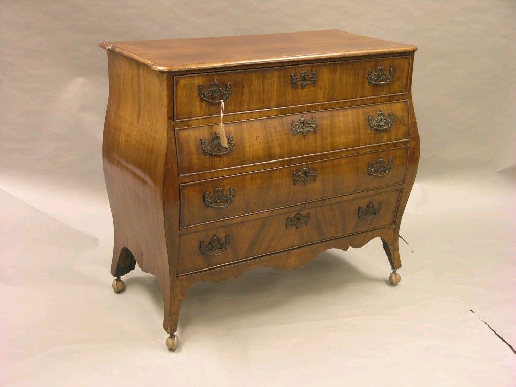 Appraisal: A th century Dutch mahogany bombe commode four long cock-beaded