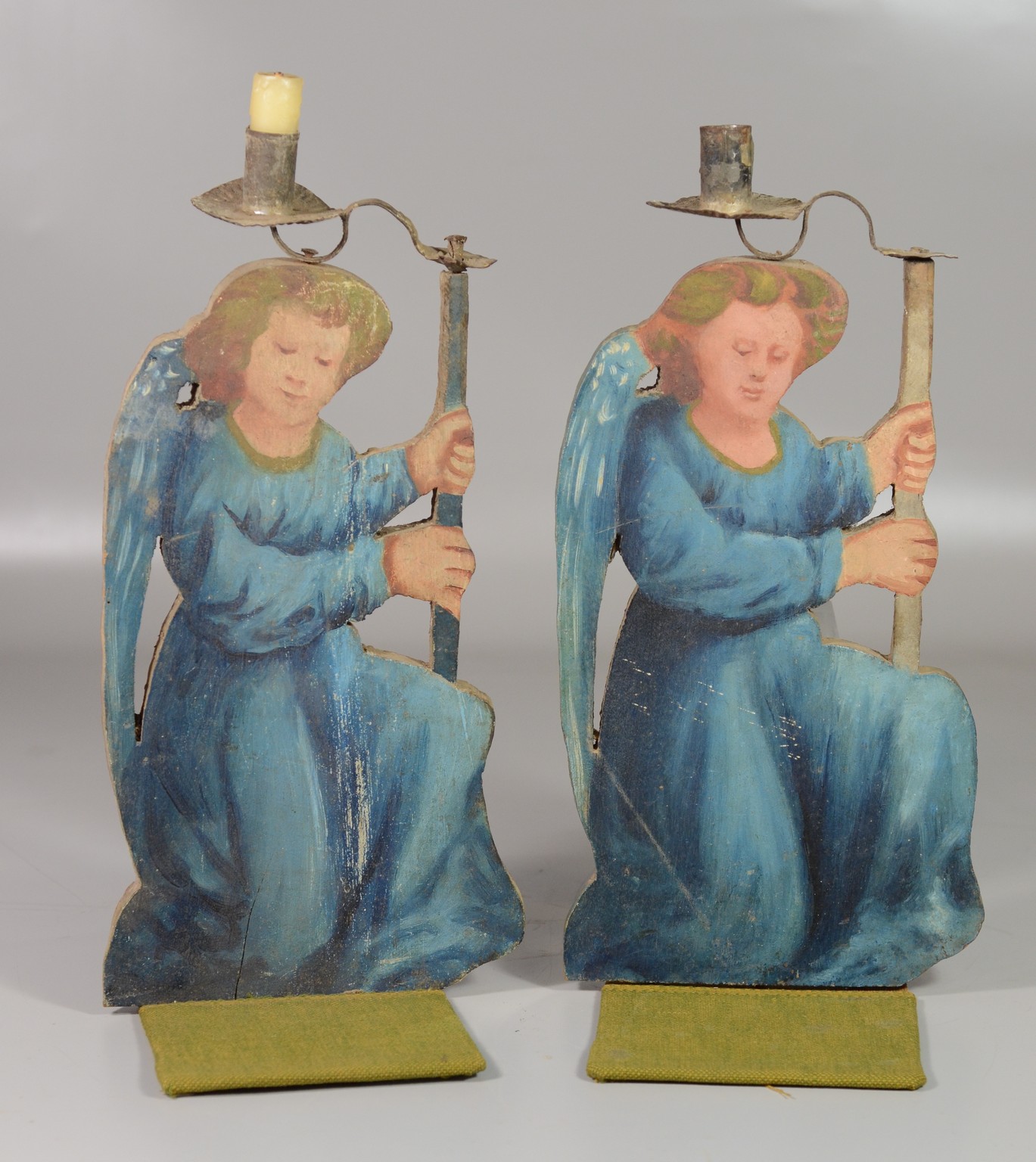 Appraisal: Pair painted wood candleholders of kneeling angel figures kneeling h