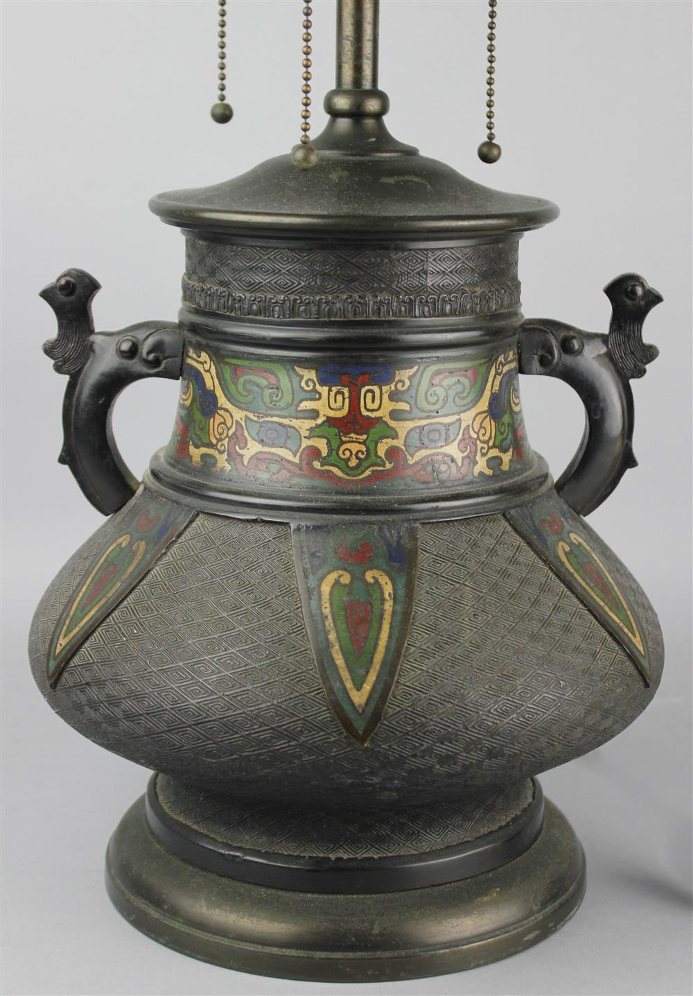 Appraisal: CHINESE BRONZE AND CHAMPLEVE ENAMEL ARCHAISTIC LAMP QING DYNASTY CIRCA