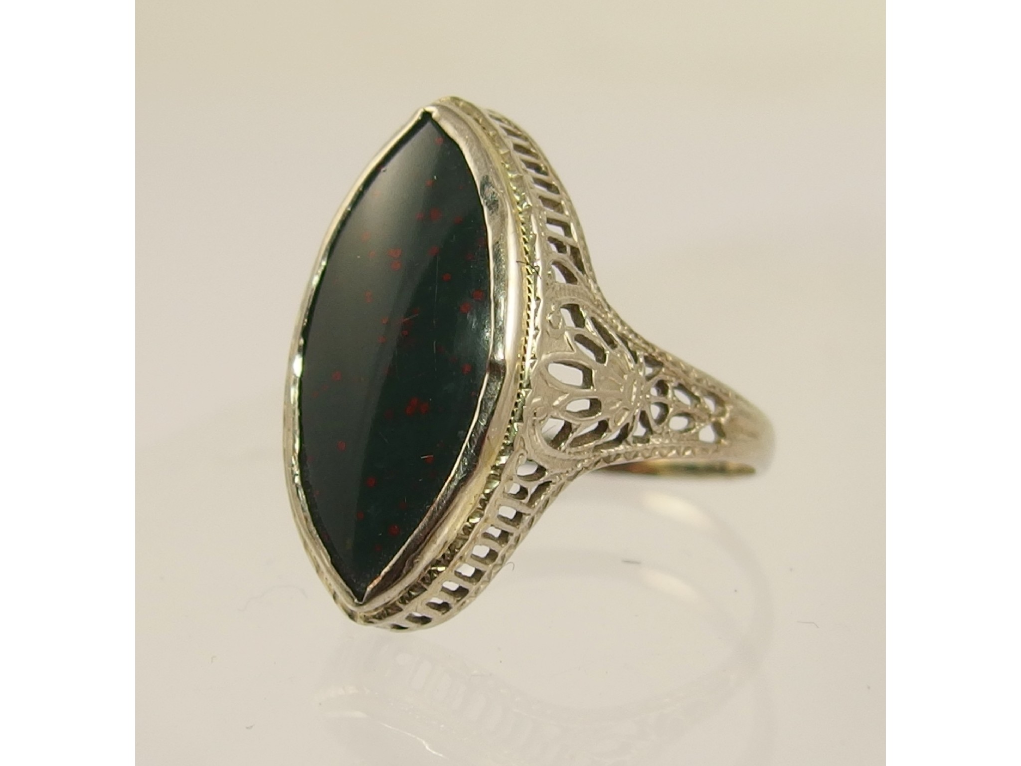 Appraisal: A k gold filigree ring set with a blood stone