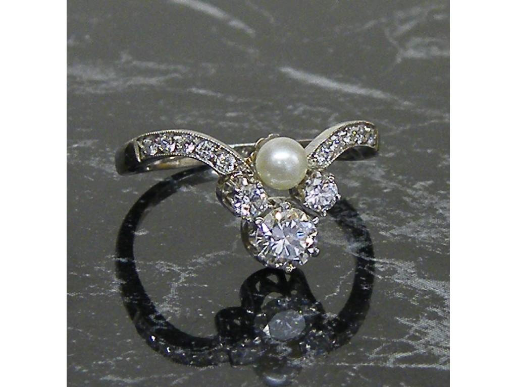 Appraisal: Attractive white gold diamond and pearl set wishbone ring size