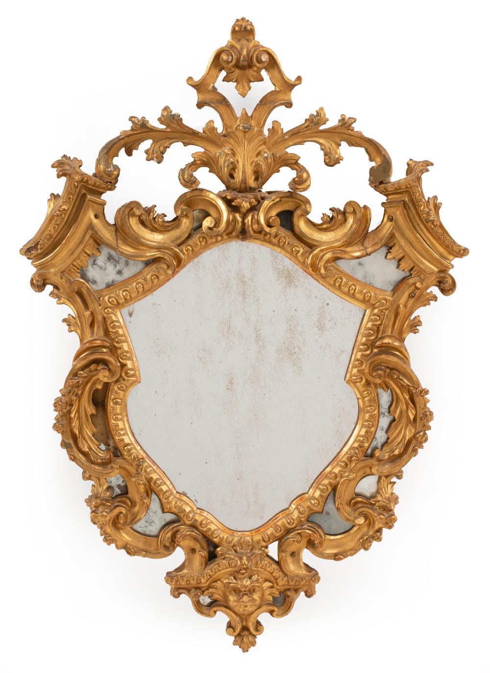 Appraisal: Antique Chippendale-Style Carved Giltwood Mirror foliate scrolled crest and surround