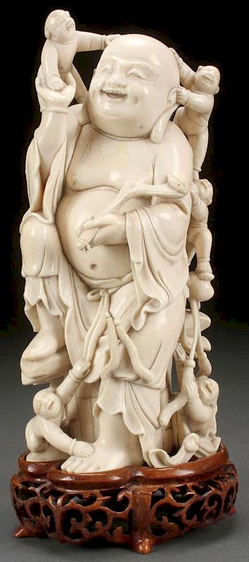 Appraisal: A CHINESE CARVED IVORY BUDDHA LATE TH EARLY A CHINESE