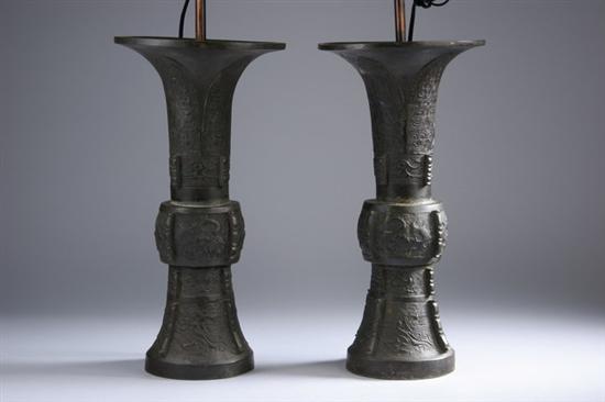 Appraisal: PAIR CHINESE ARCHAISTIC BRONZE GU-FORM VASES th century Taotie mark