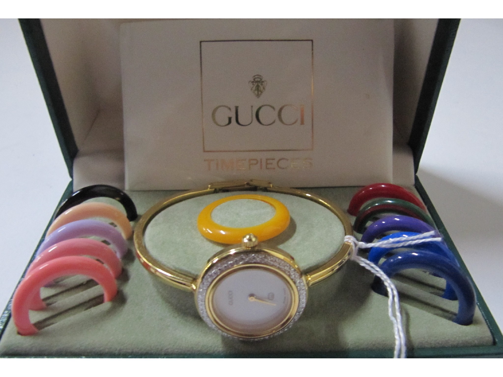 Appraisal: A ladies Gucci wristwatch with interchangeable bezels in box with