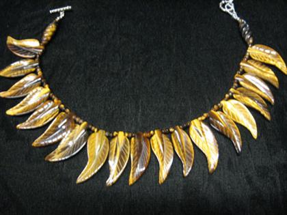 Appraisal: Tiger Eye necklace Tiger eye necklace with leaf shaped beads