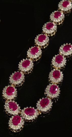 Appraisal: Fourteen-Karat Yellow Gold Ruby and Diamond Necklace the flexible ribbon