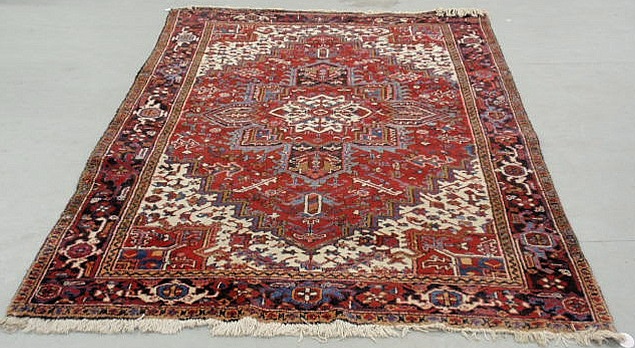 Appraisal: Heriz oriental carpet red field and center medallion x