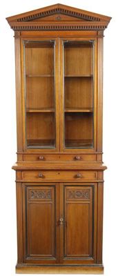 Appraisal: A late Victorian walnut narrow bookcase cabinet the detachable dentil