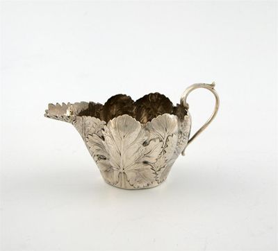 Appraisal: A George III silver naturalistic silver cream jug marked with