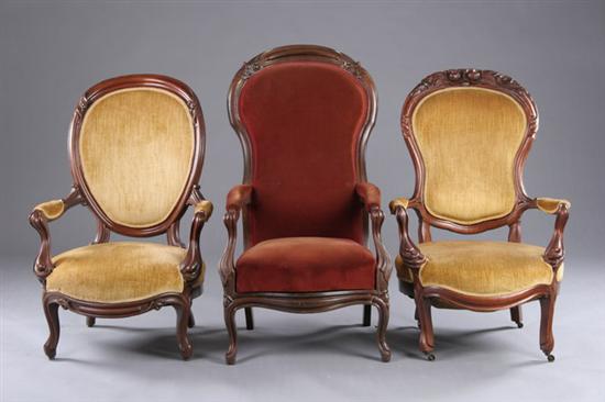 Appraisal: THREE ROCOCO REVIVAL PARLOR ARM CHAIRS mid- th century walnut